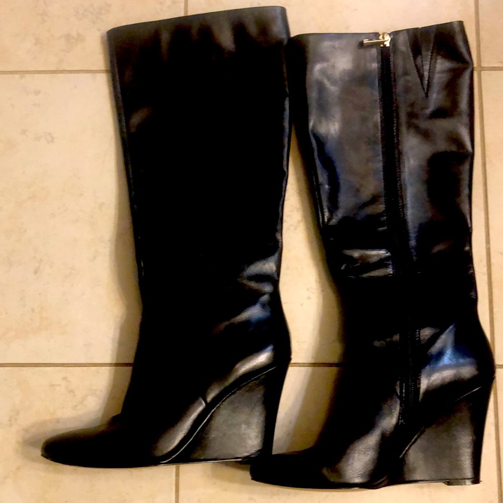 Ann Taylor leather black boots. Worn one time. Nee condition. 2 inch wedge heel